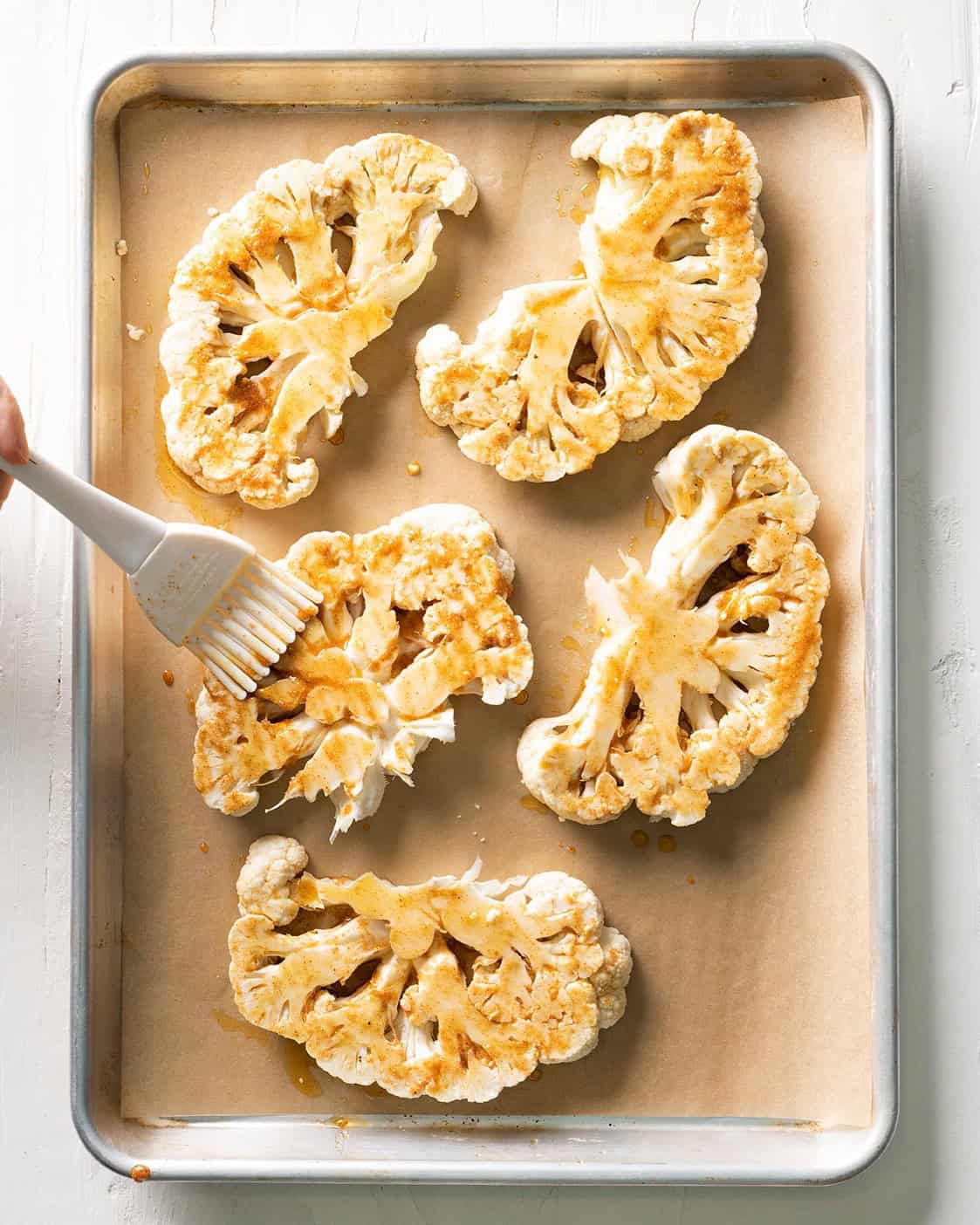 Roasted Cauliflower after brushing the seasoning on.
