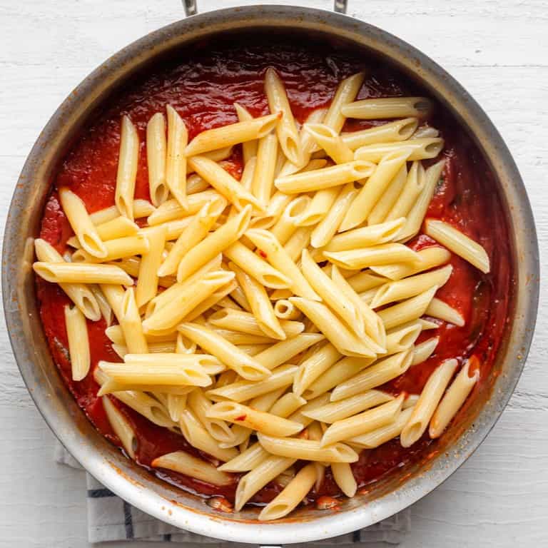 Pasta added on top of the sauce.