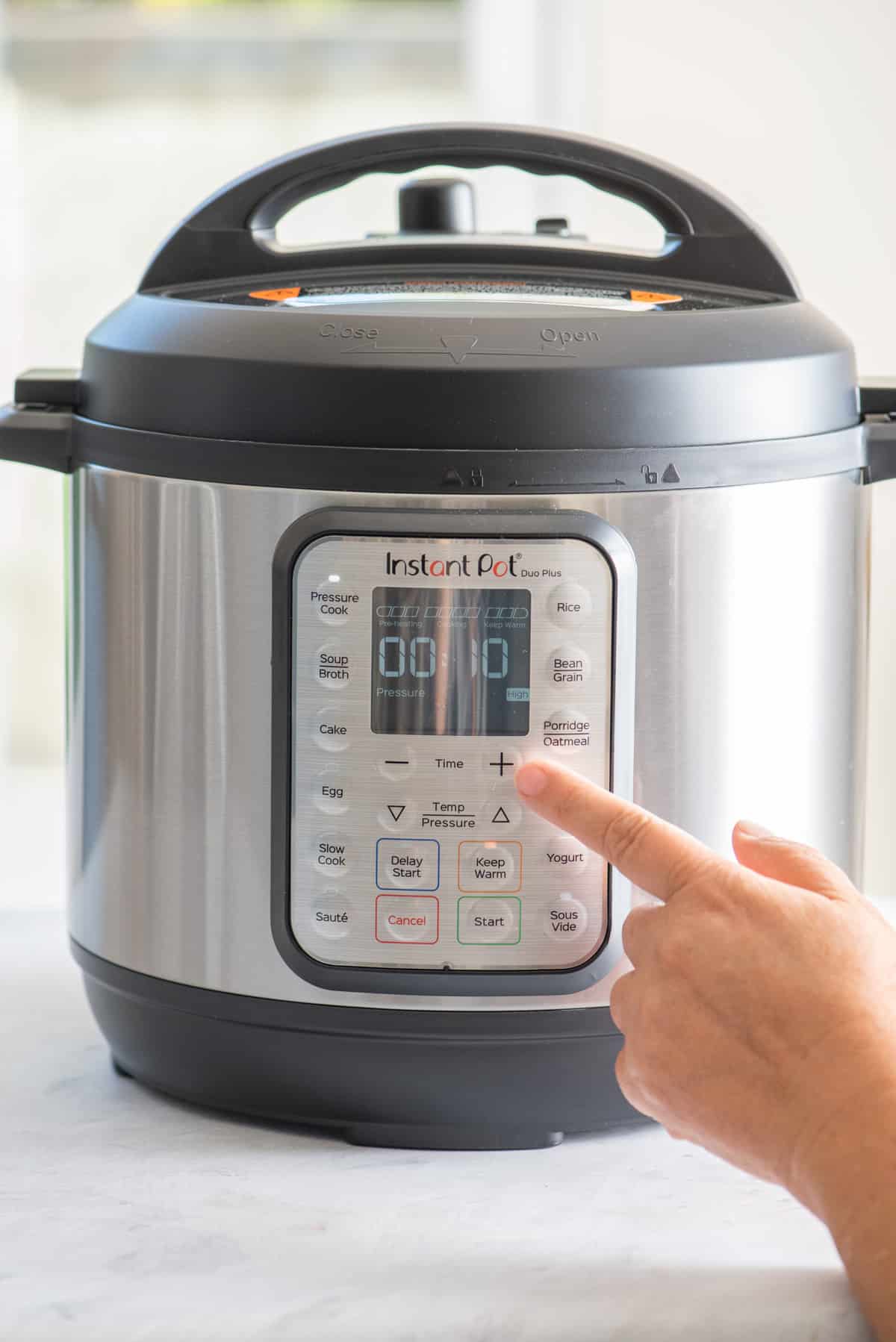 Selecting timer on Instant Pot for the chicken recipe