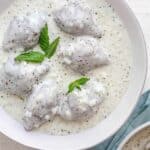 Kibbeh bi labanieh - traditional Middle Eastern dish in a large bowl of yogurt sauce
