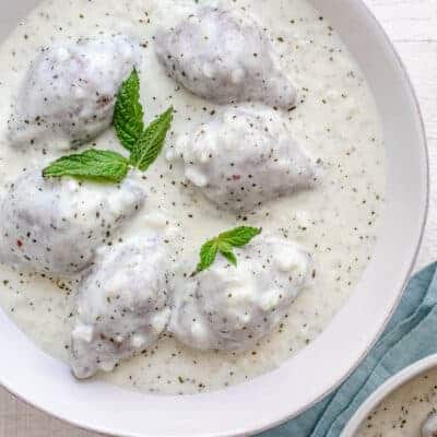 Kibbeh bi labanieh - traditional Middle Eastern dish in a large bowl of yogurt sauce