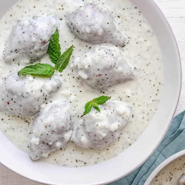 Kibbeh bi labanieh - traditional Middle Eastern dish in a large bowl of yogurt sauce