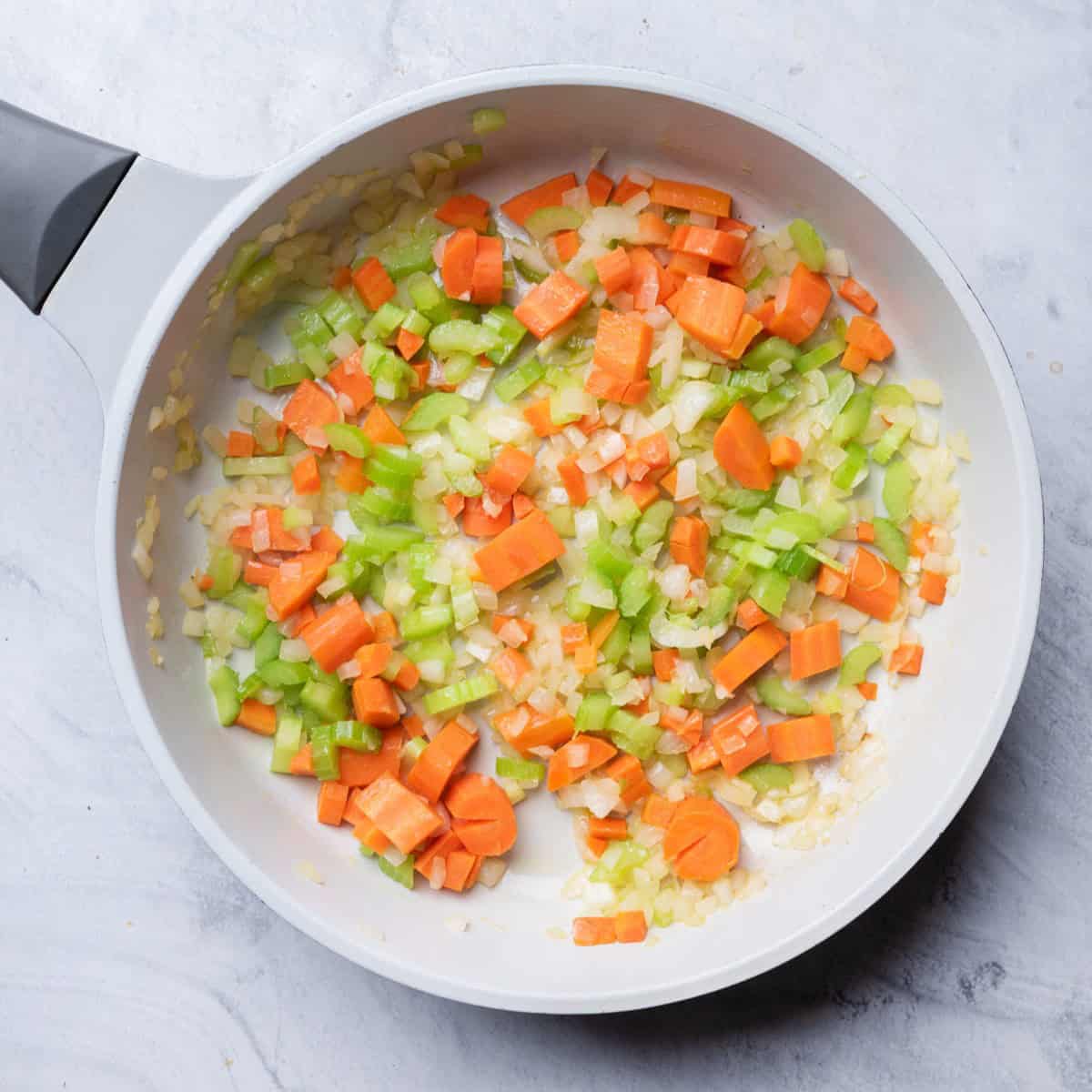 Cooked onions, celery and carrots.