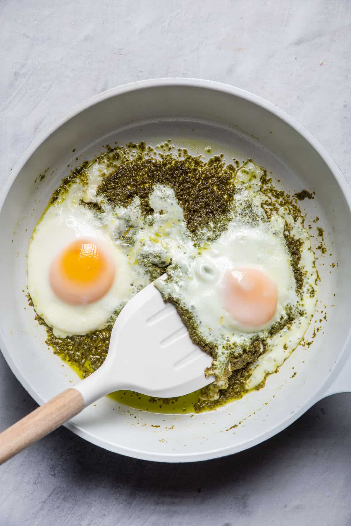 Spatula sliding under eggs after they're cooked