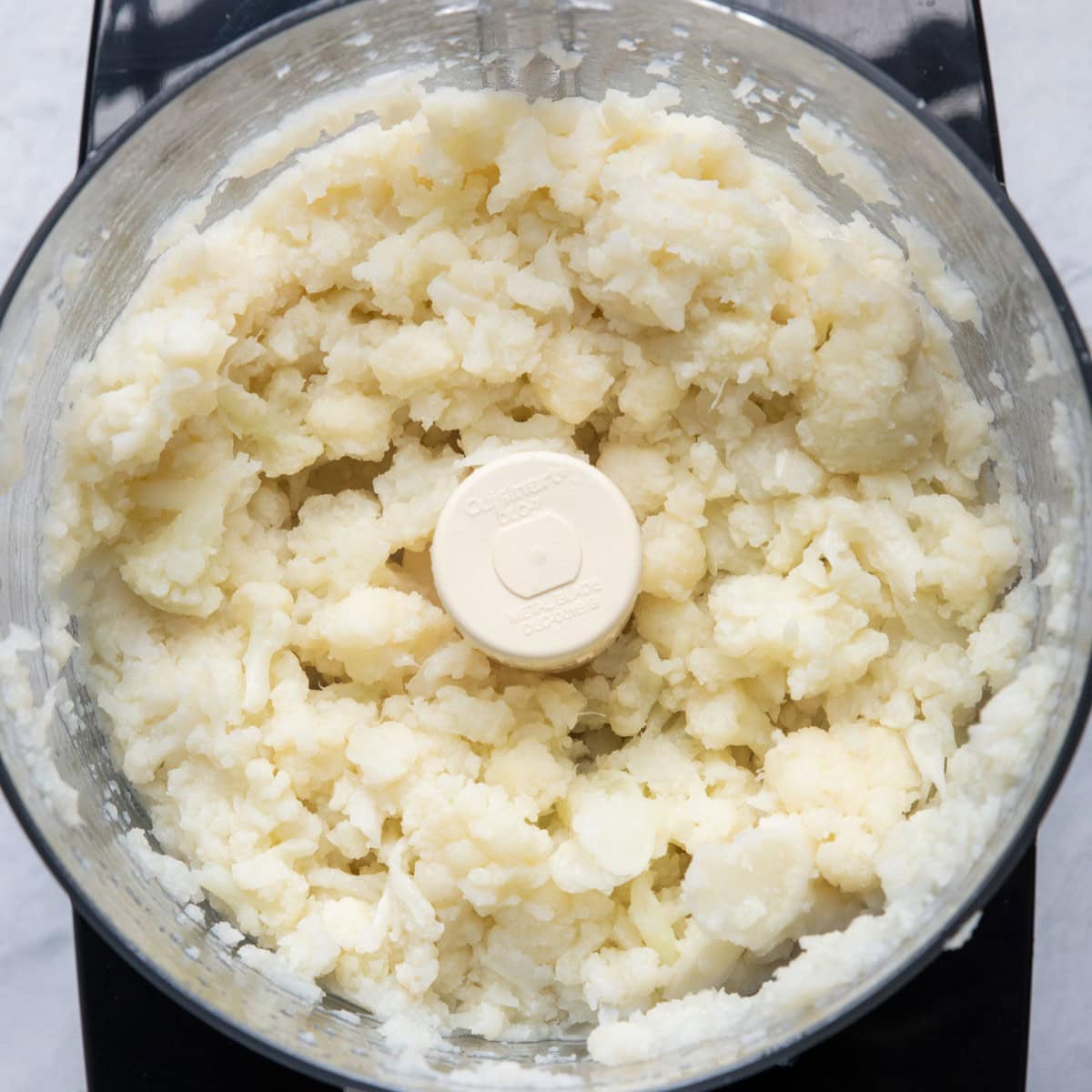 Riced cauliflower in food processor.