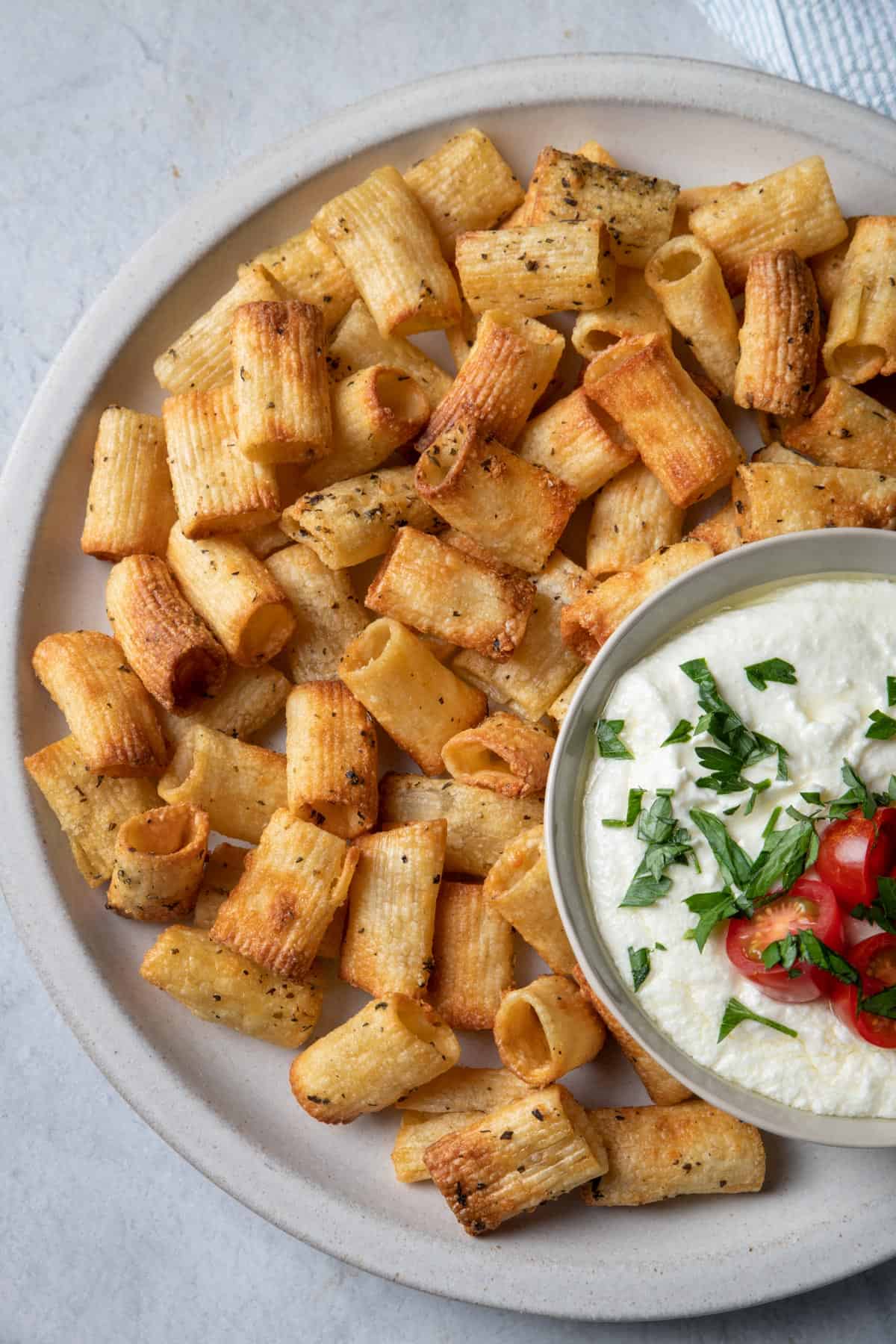 Close up shot of the pasta chips with the whipped feta dip