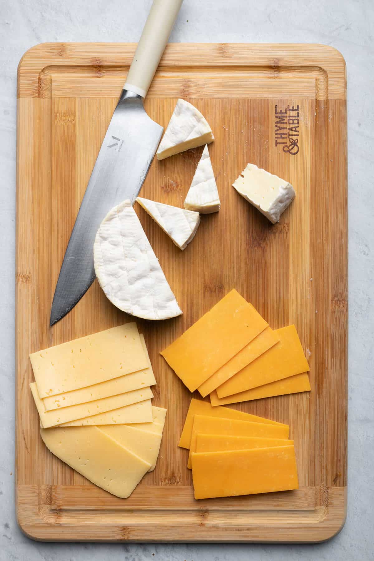 Slicing cheeses for the bistro box