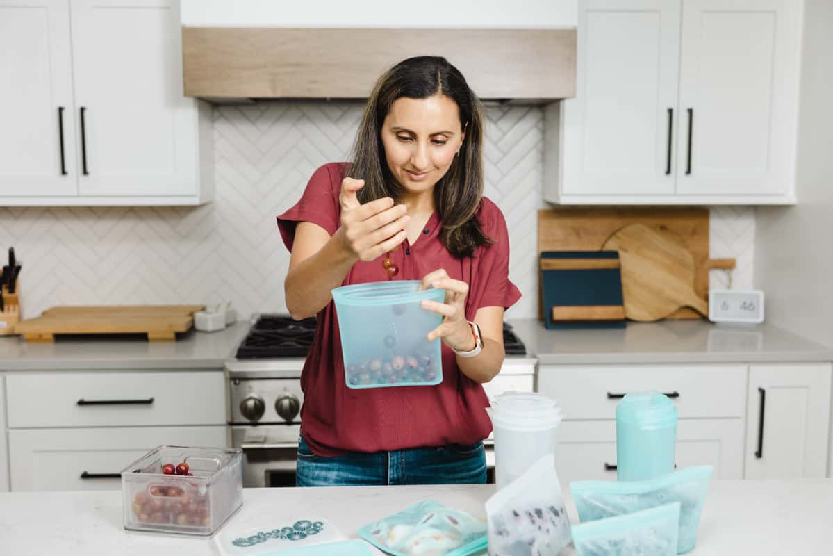 Adding blueberries into meal silicone bags