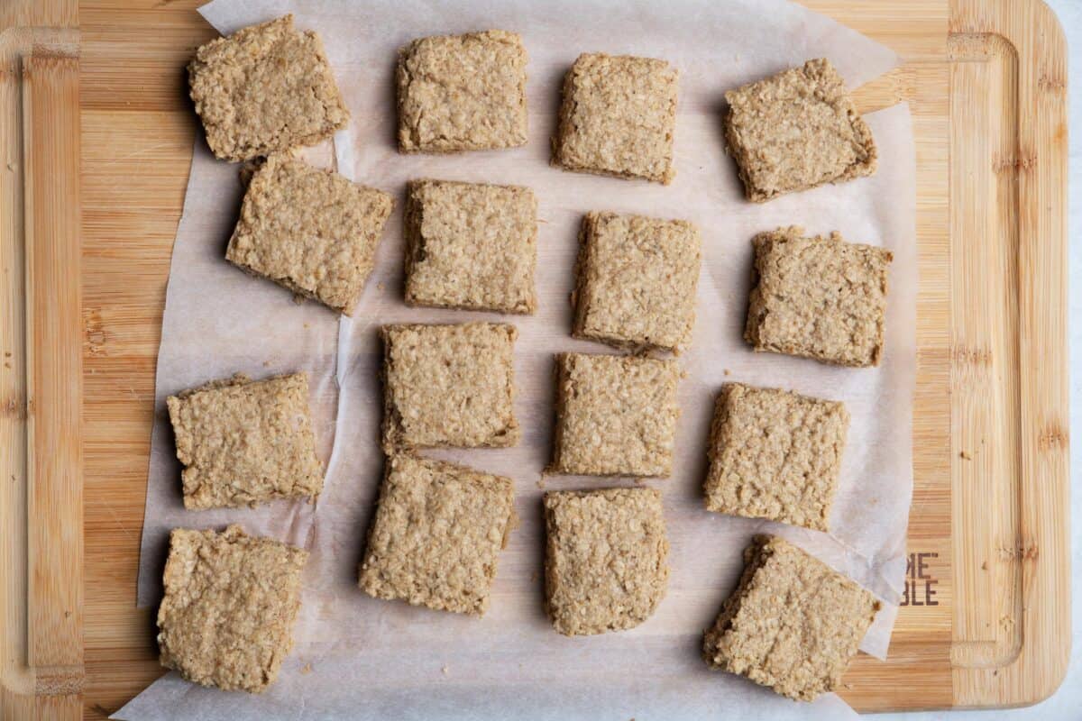 Starbucks oat bars cut up with hand grabbing one