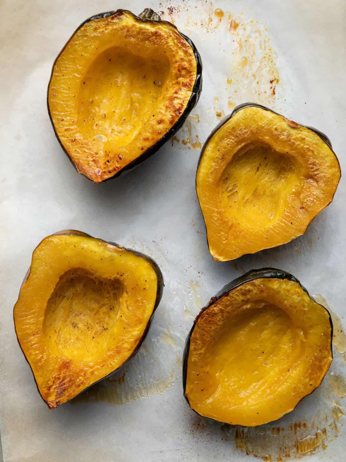 Acorn squash cut side up after cooking.