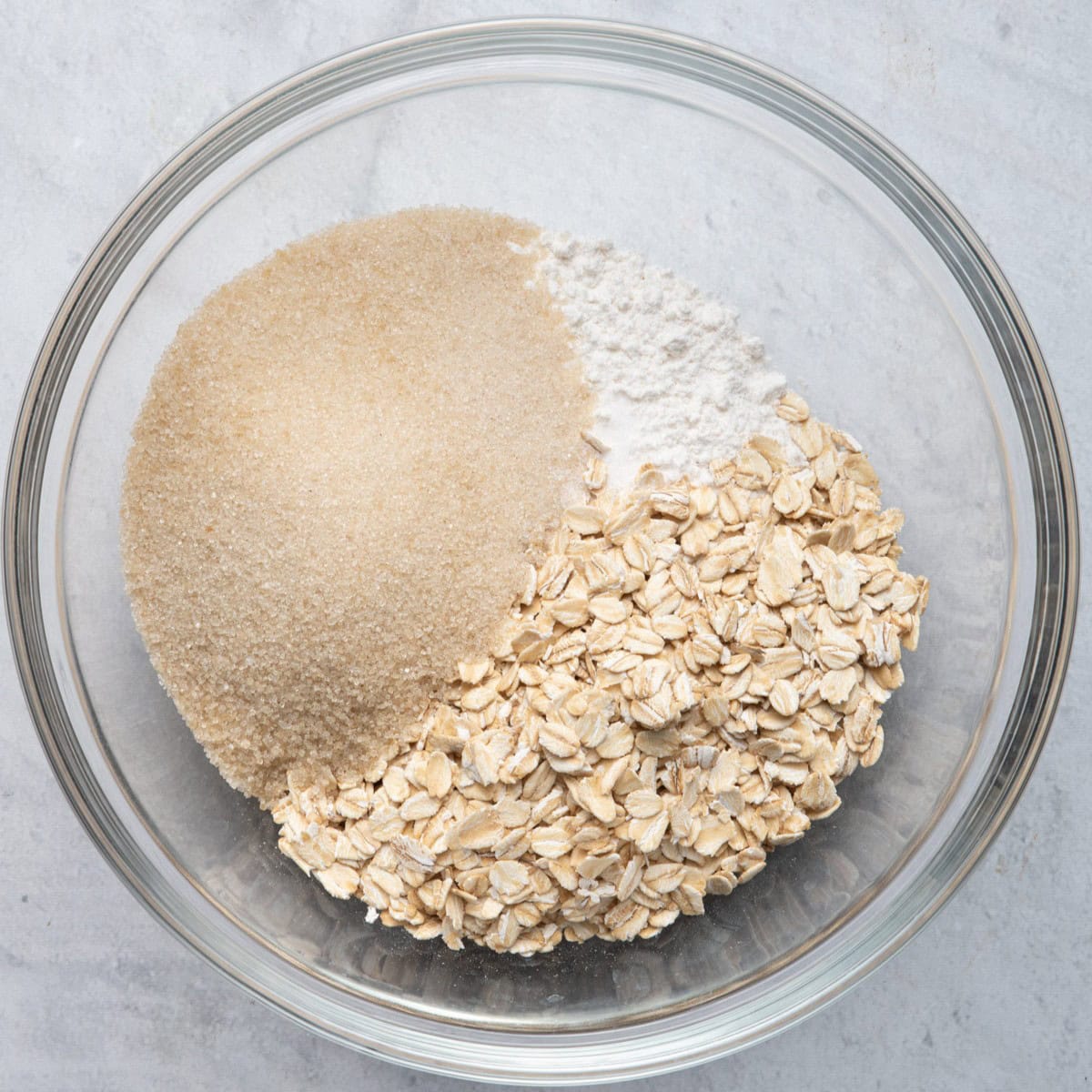 Bowl with oats, flour, brown sugar and salt.