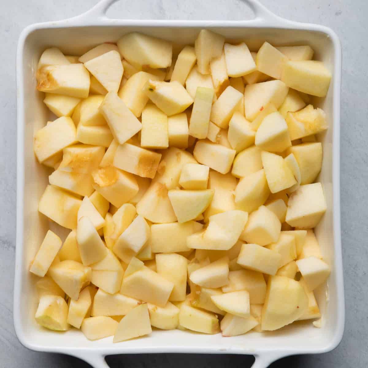 Apples in greased dish.