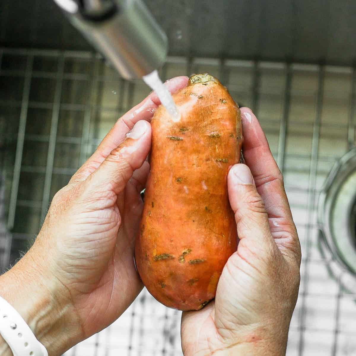 Washing a potato.
