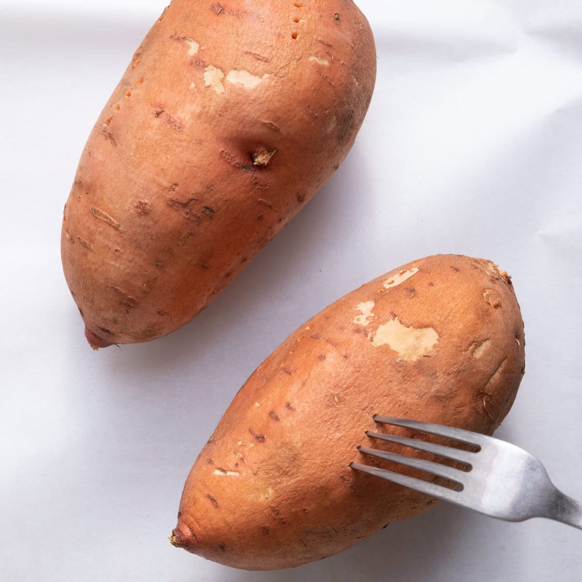 Poking holes in a potato.