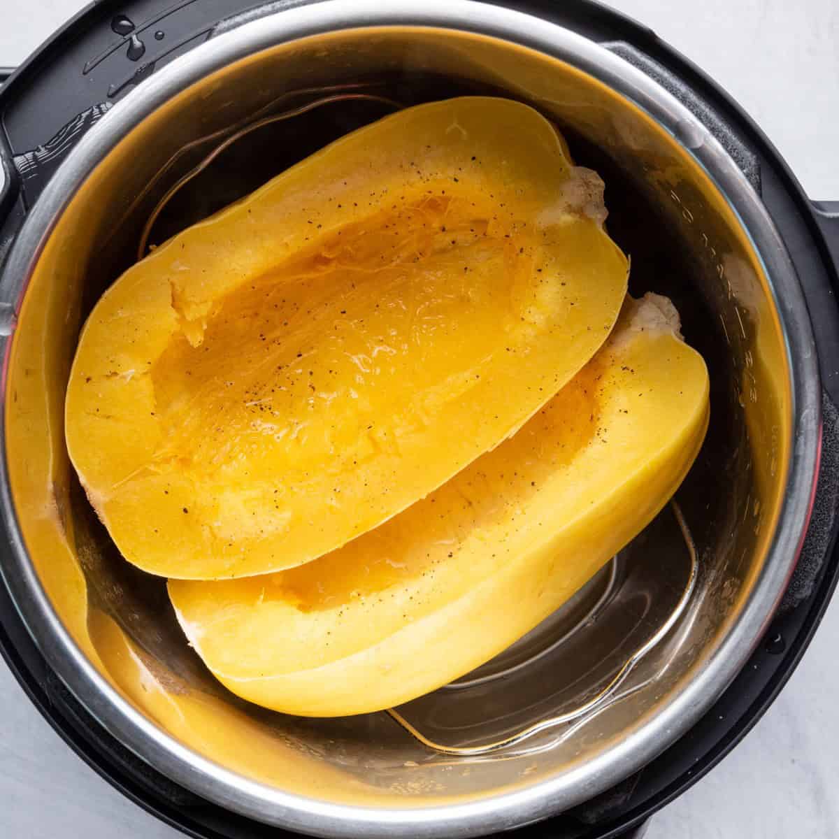 Cooked spaghetti squash in pot.