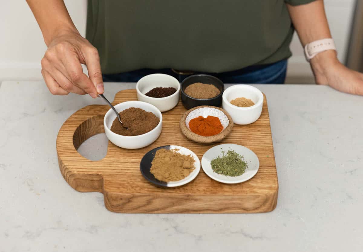 Scooping spice from a bowl
