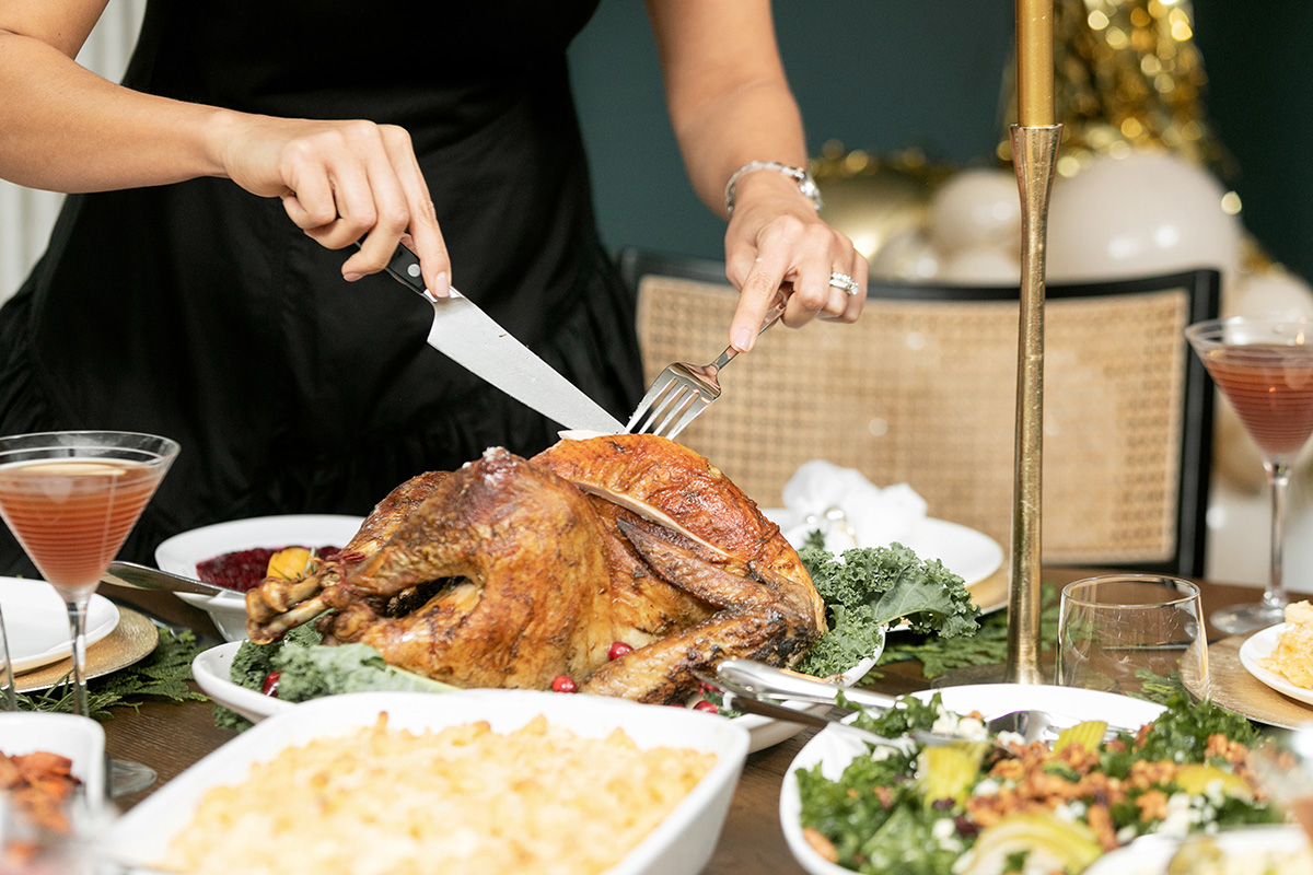 Placing carved thanksgiving platter on table