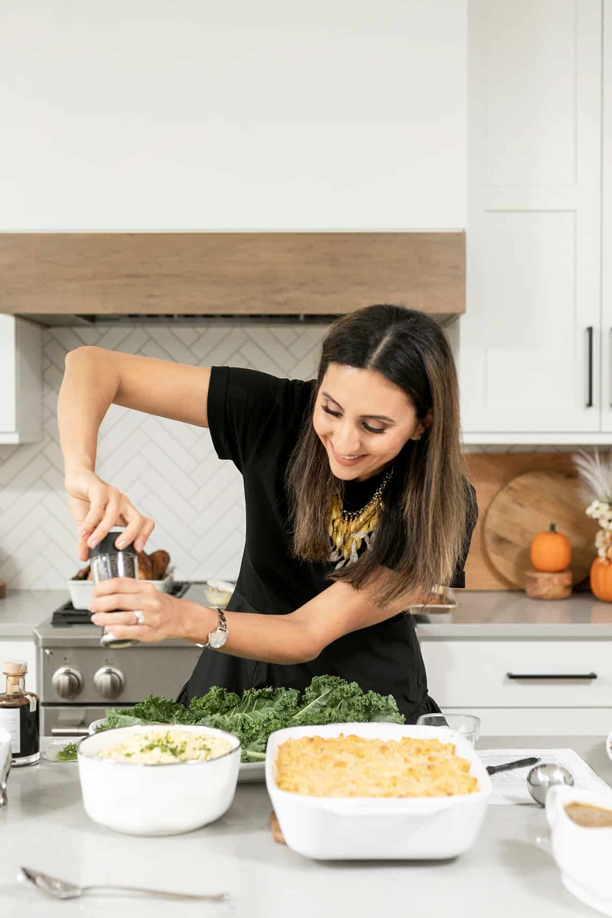 Yumna tossing salad for thanksgiving meal