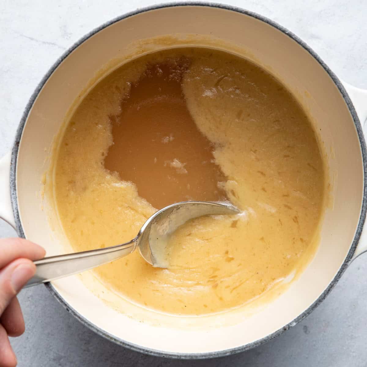 Skimmed off fat with a spoon.