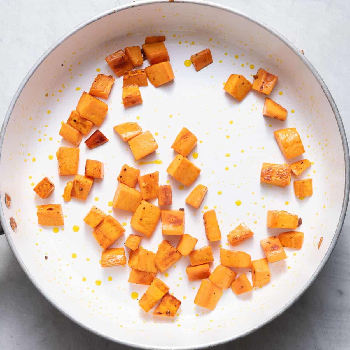 Sweet potato cubes in a pan.