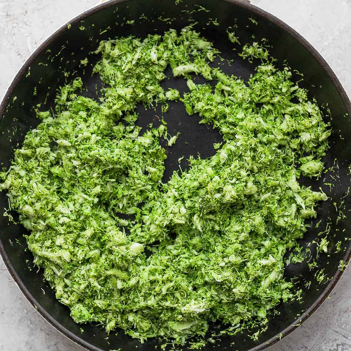 Pan with grated broccoli after cooking.