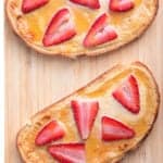 2 yogurt toasts topped with sliced strawberries