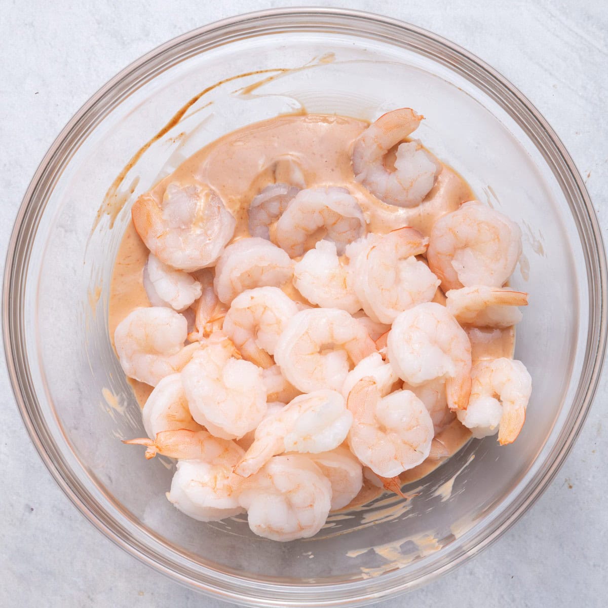 Shrimp added on top of cocktail sauce.