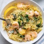 Spaghetti squash shrimp scampi finished product with crushed red pepper in small bowl