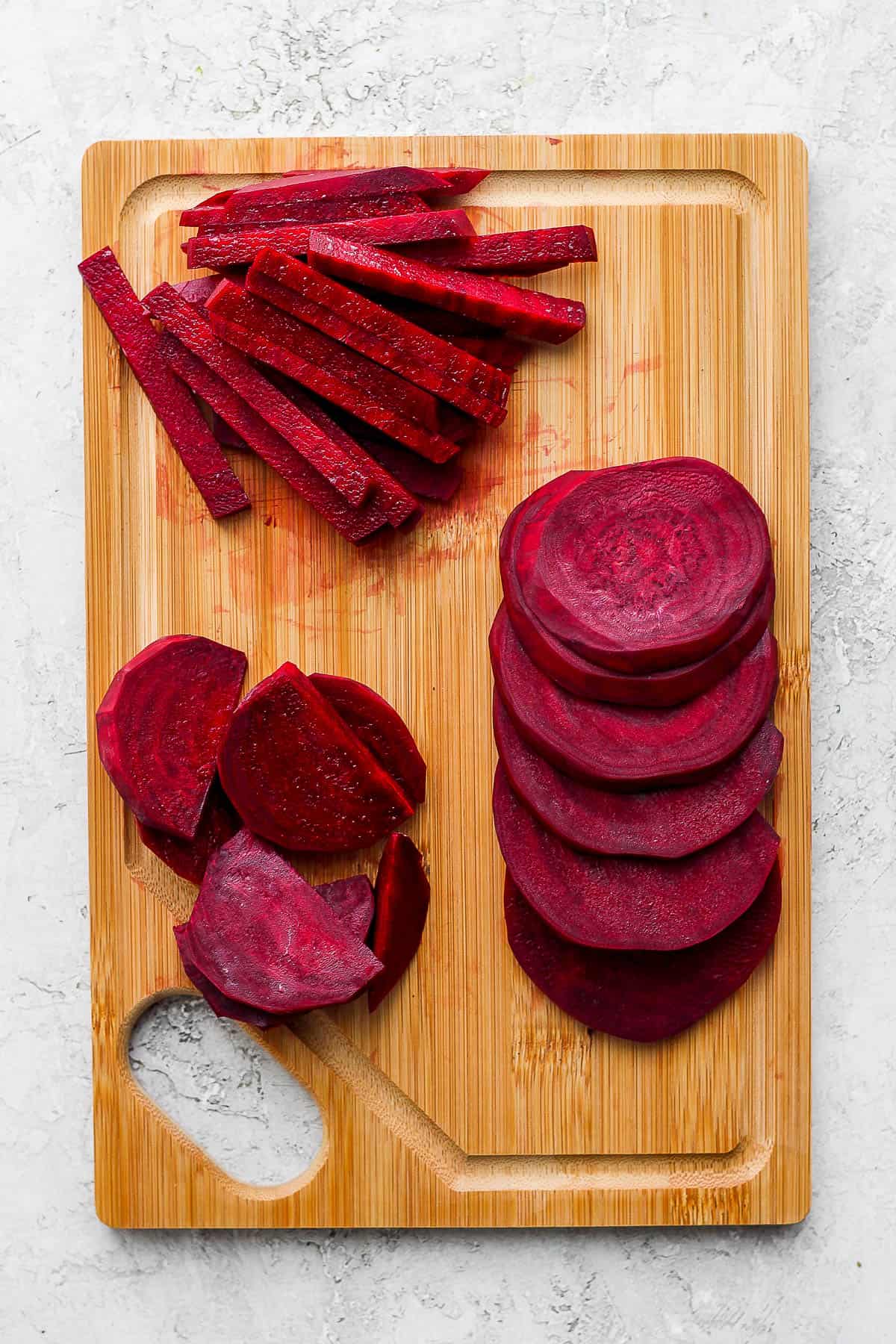 Cutting board with three types of cut beets