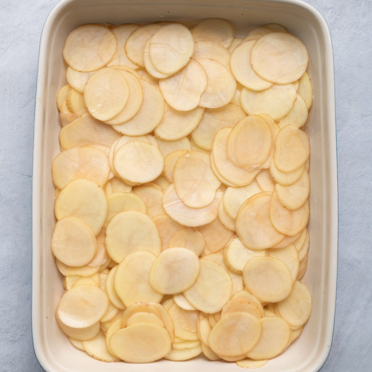Half potatoes in dish.