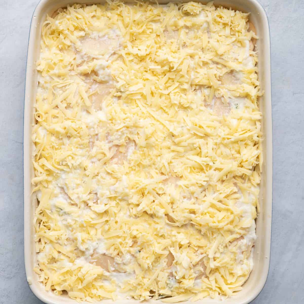 Remaining potato slices, milk and cheese added, ready for oven.