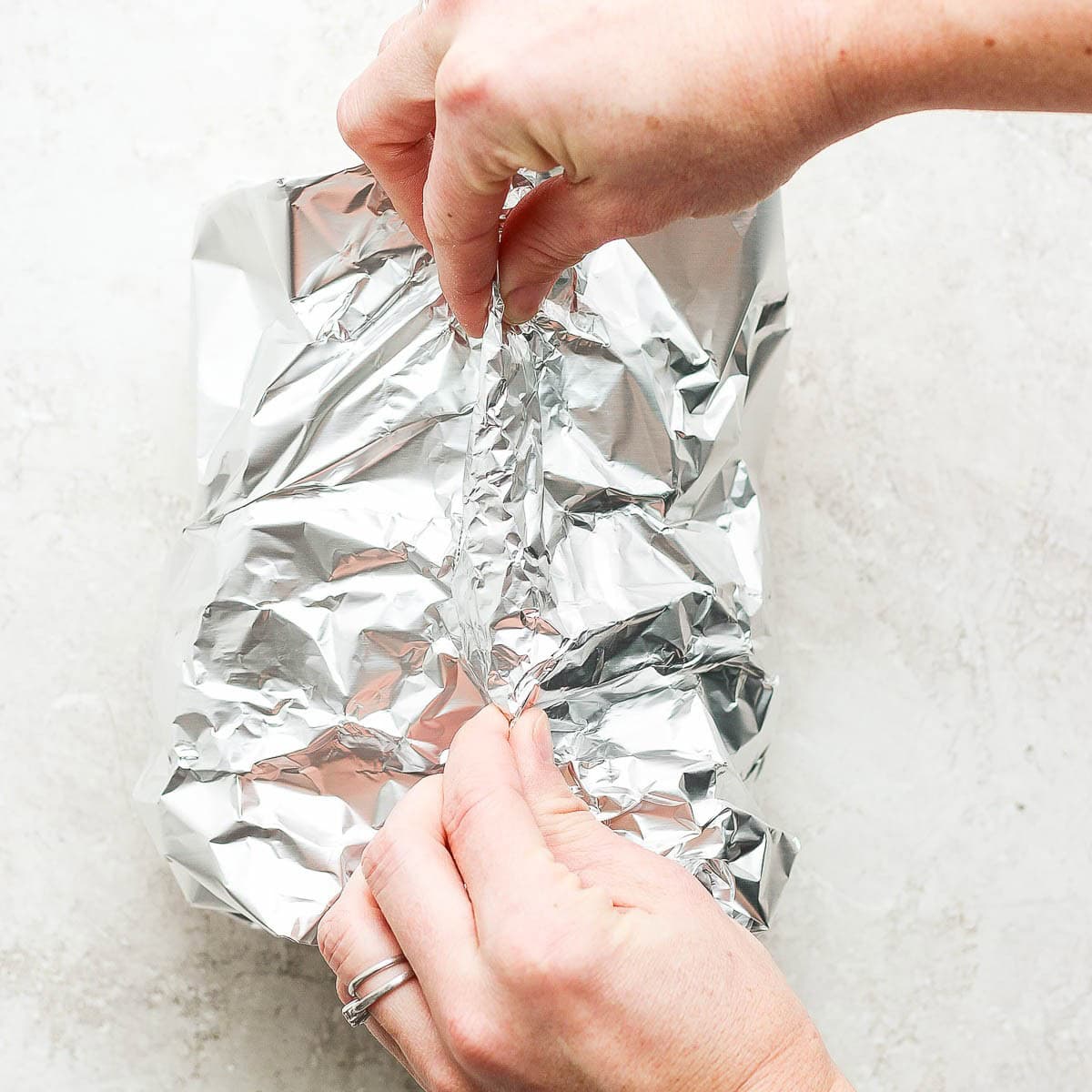Closing the foil to make a pouch.
