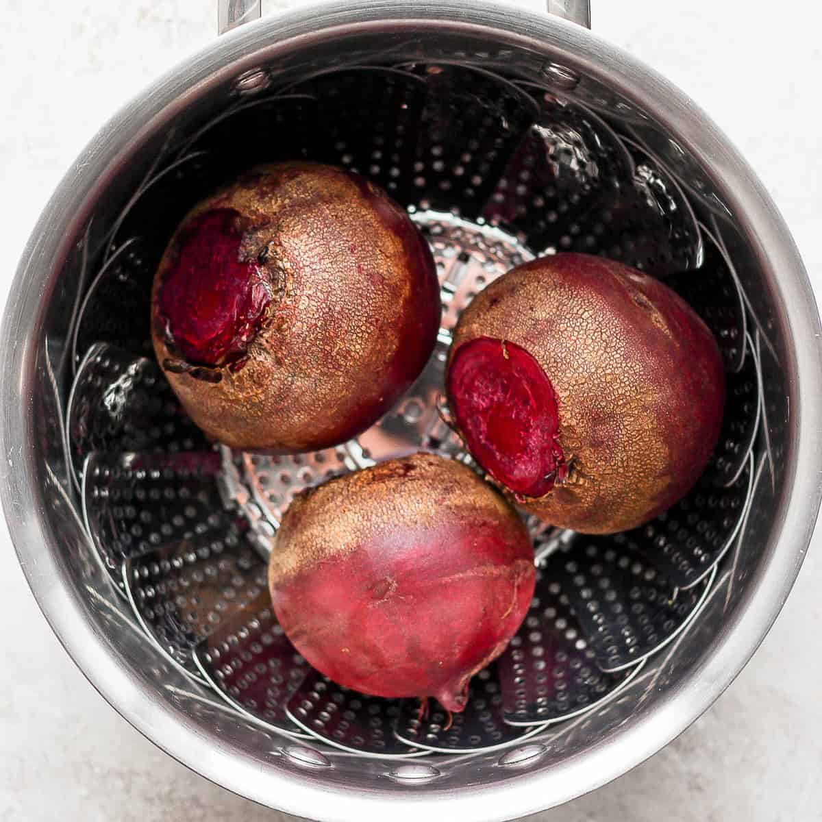 Beets in steamer basket before cooked.