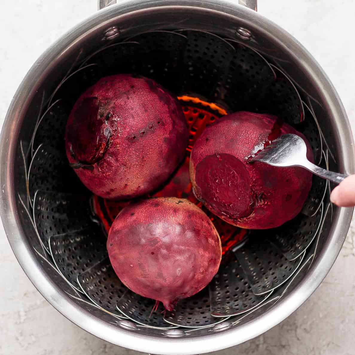 After steaming, removing the beets.
