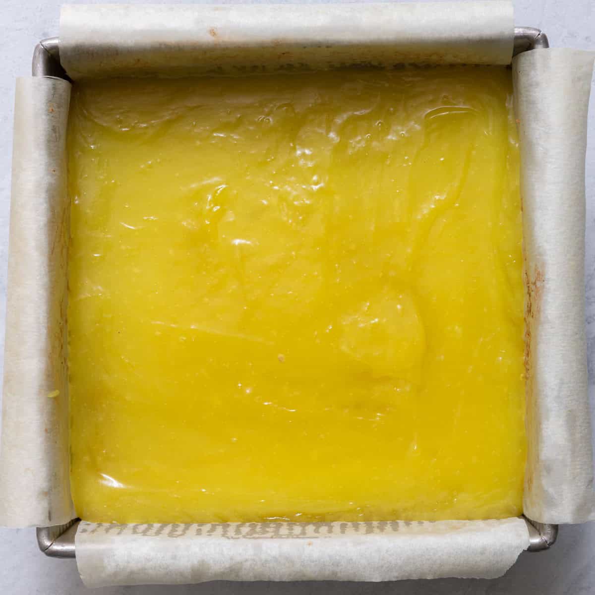 Lemon filling on top of crust before baking.