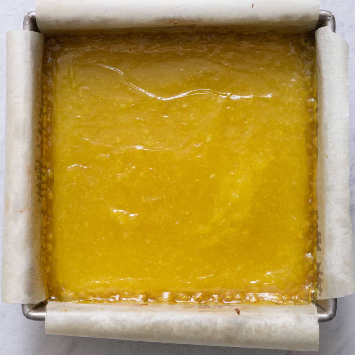 Lemon filling on top of crust after baking.