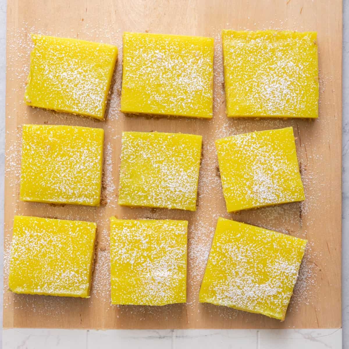 Bars cut into squares on cutting board.