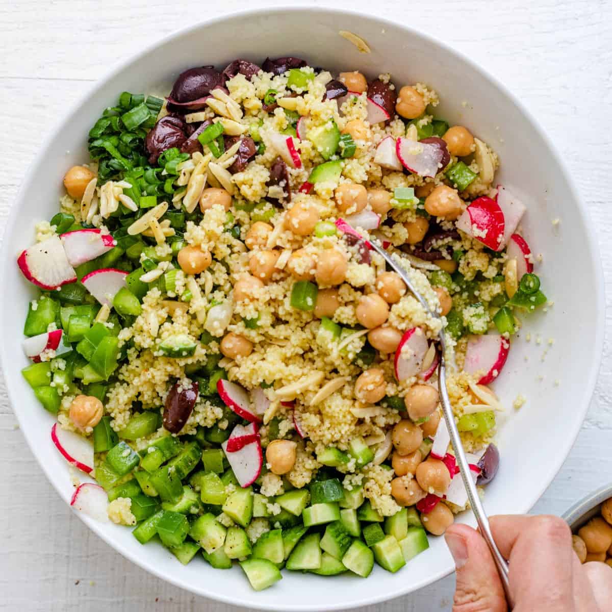 Mixing the salad.