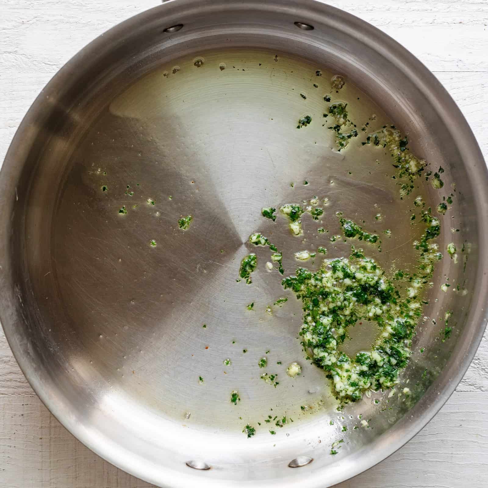 Pine nuts removed and parsley and garlic added to the pot.