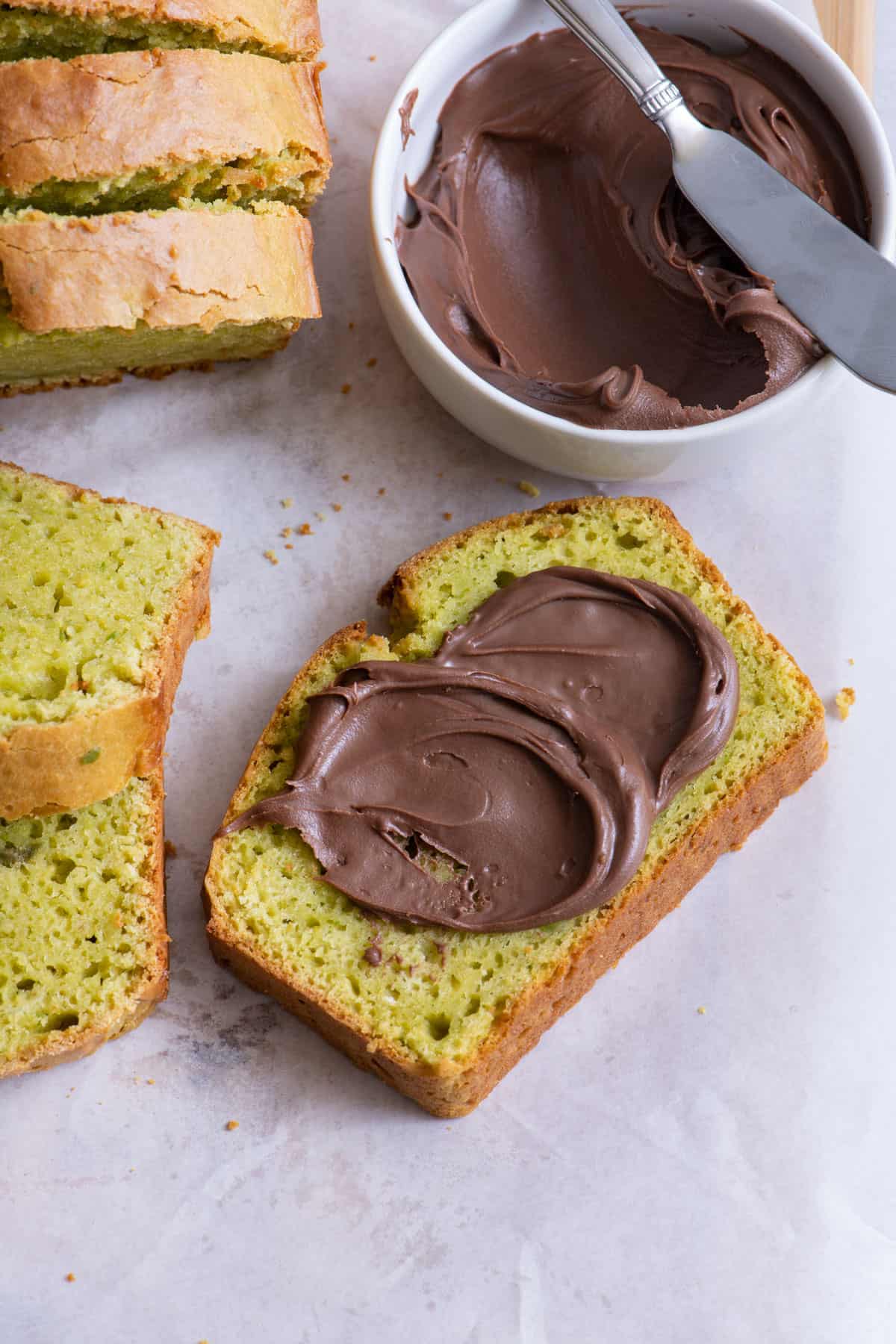 Slice of avocado bread with hazelnut spread.