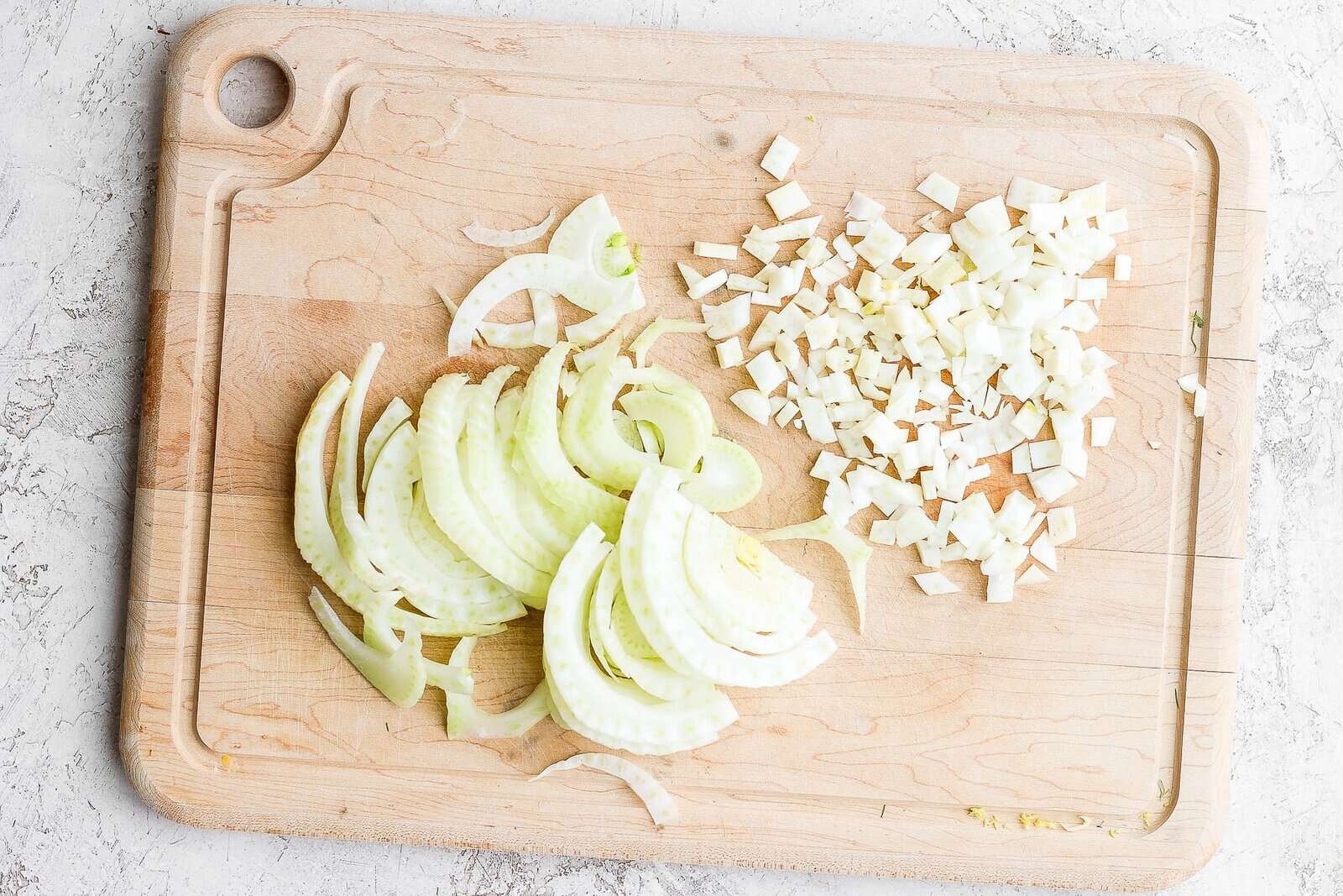 Cut fennel on cutting board - slices and dices.