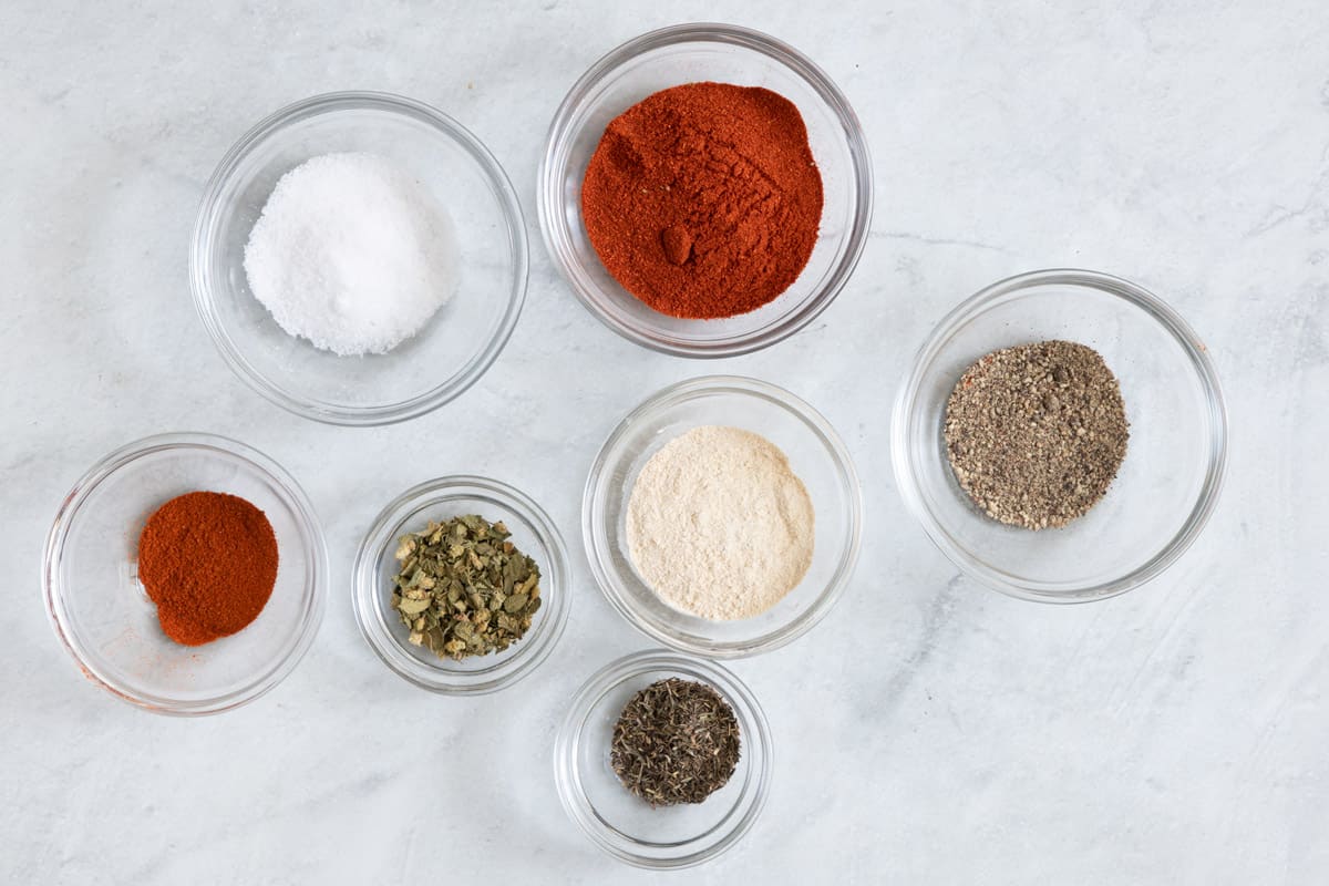 Spices in individual bowls for cajun recipe blend.