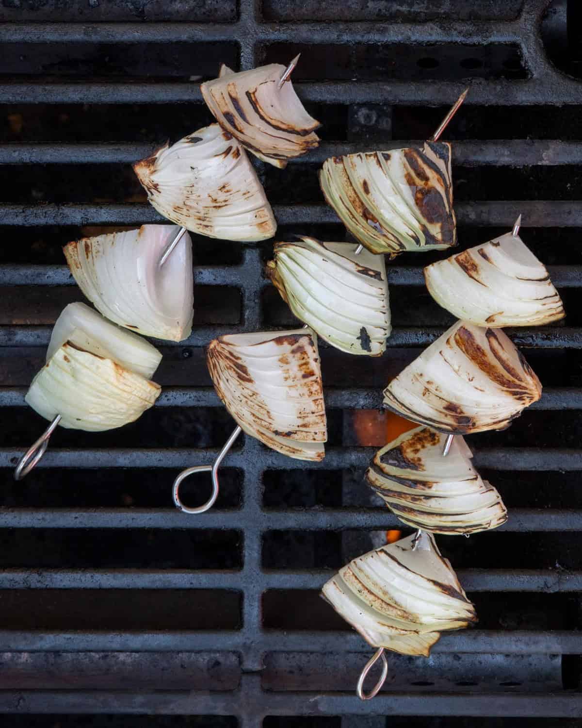 Onion chunks on grill after grilling.