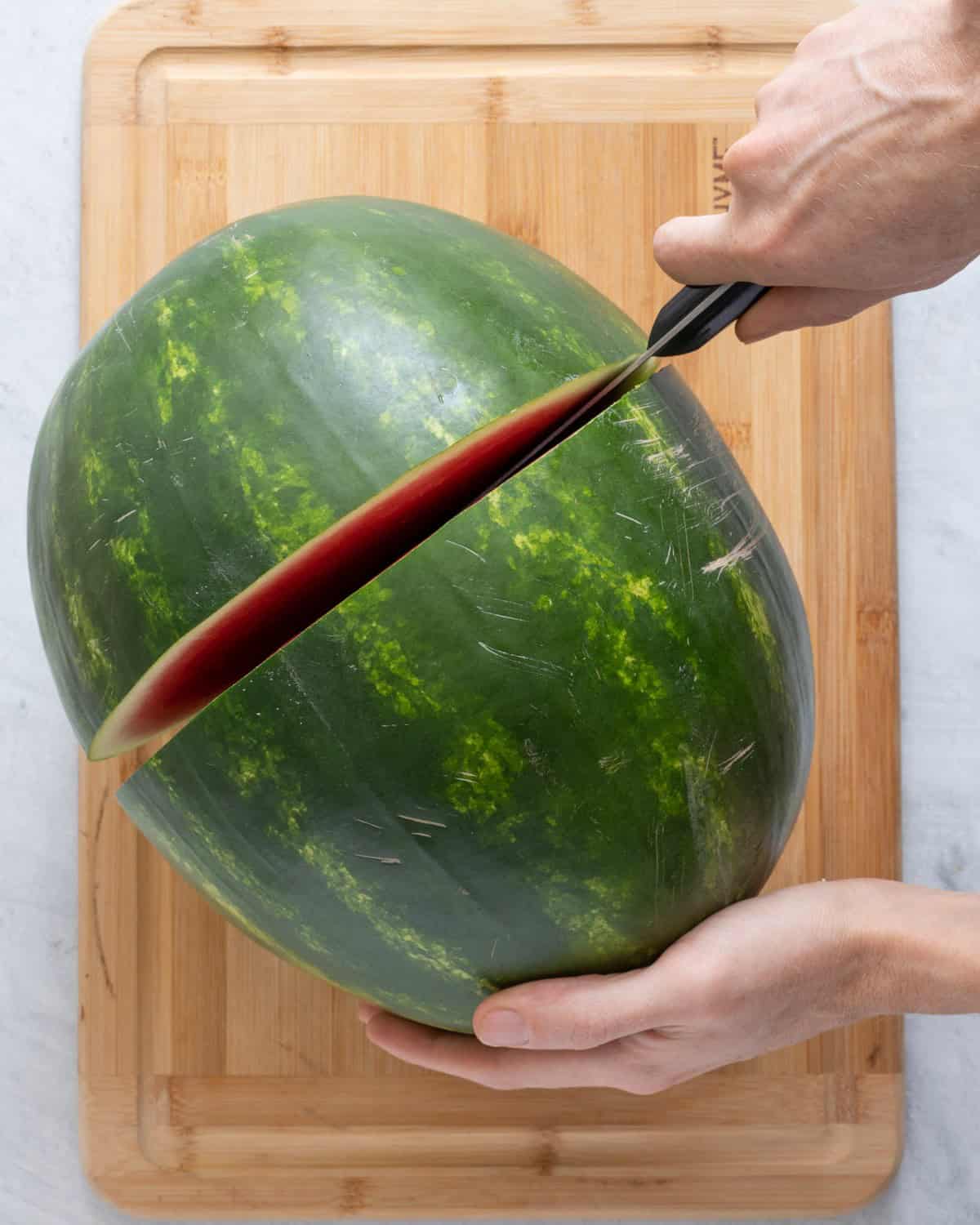 Cut watermelon in half.