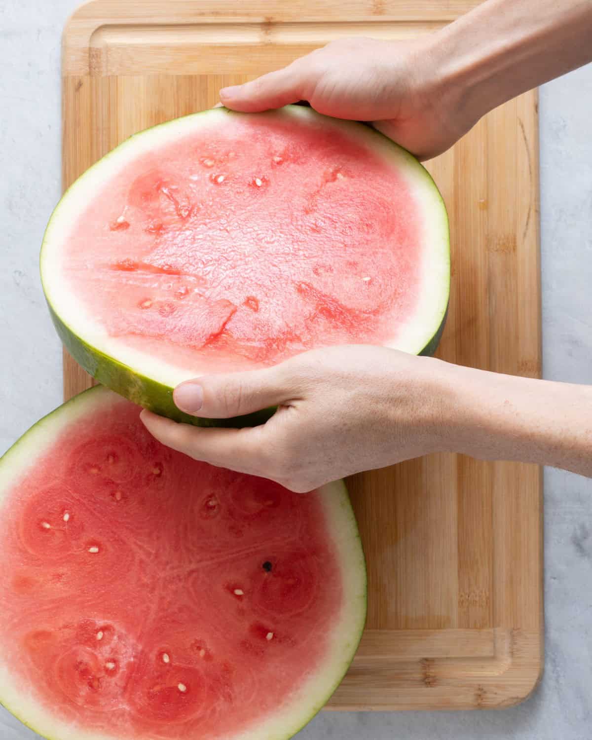 Slice off watermelon round.