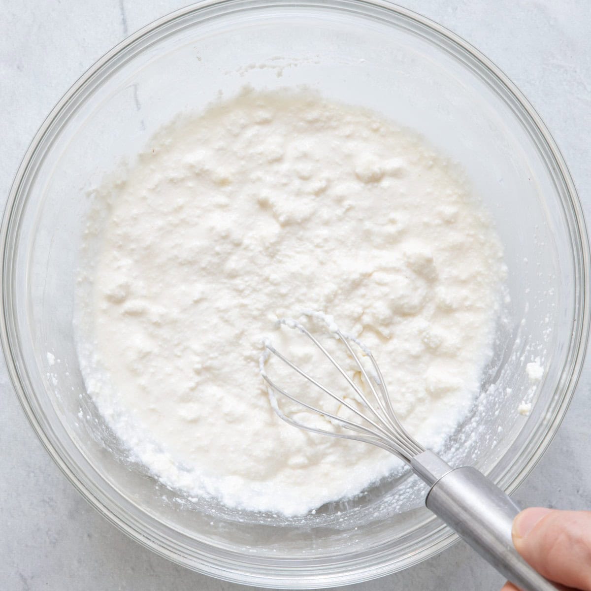 Whisk ricotta mixture in bowl.