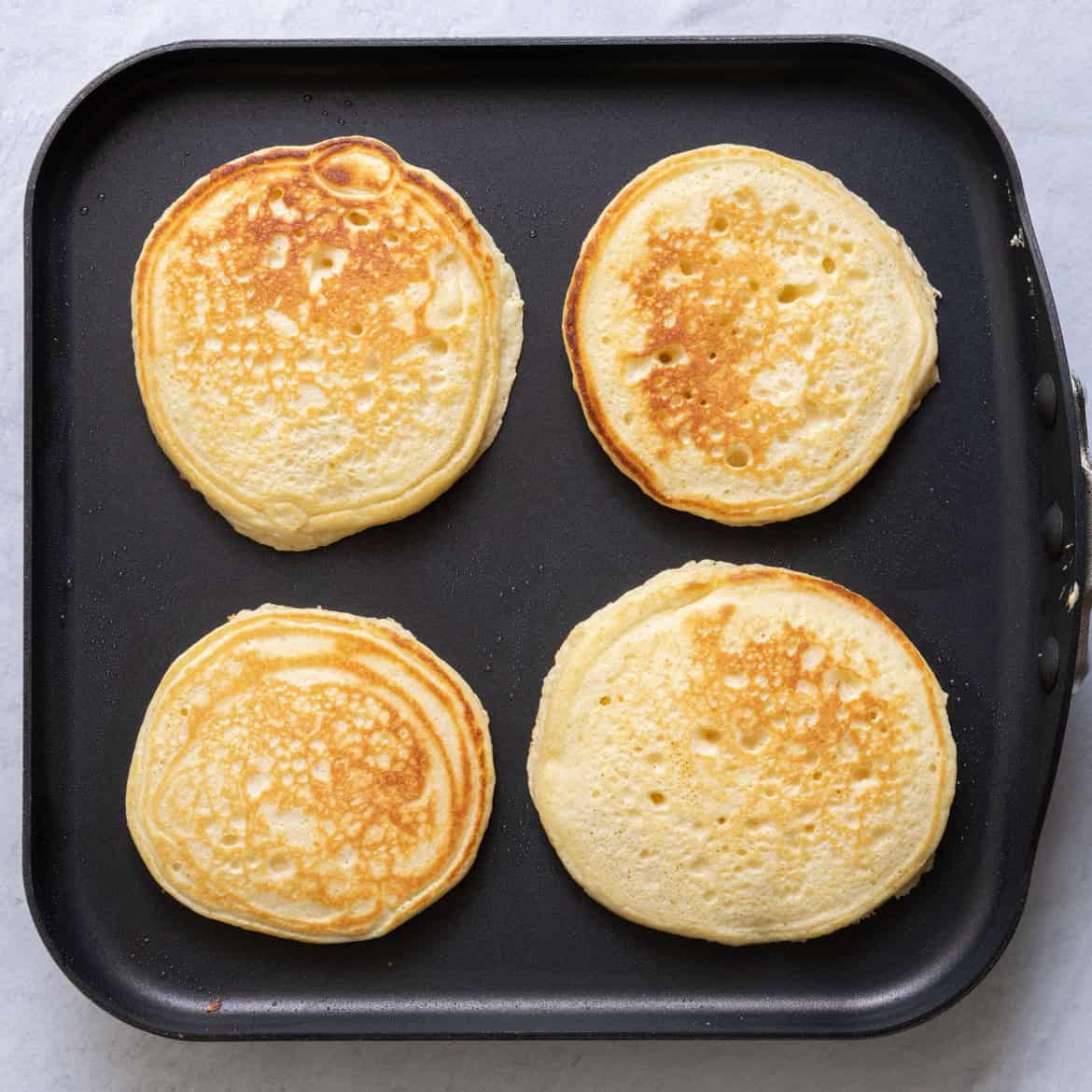 Pancakes on griddle after cooked.