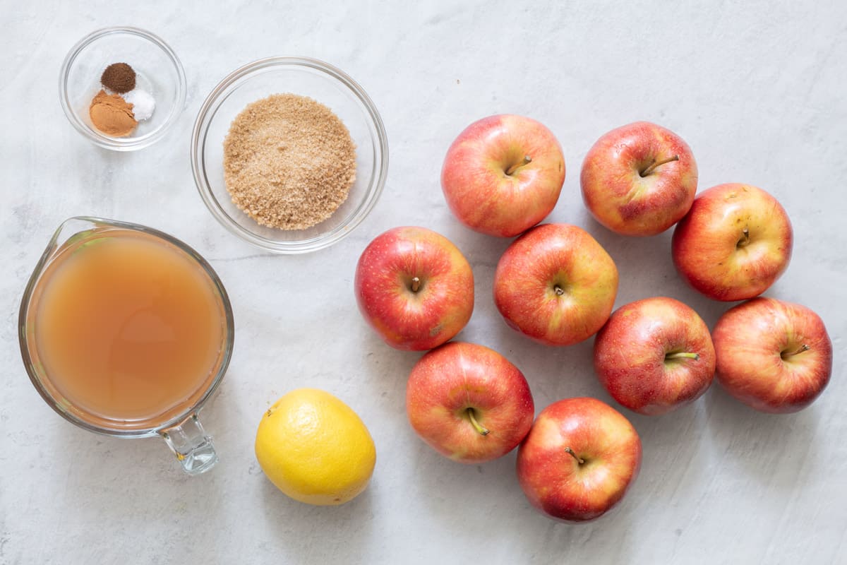 Ingredients for recipe: apple cider, spices, brown sugar, lemon, and about 9 apples.
