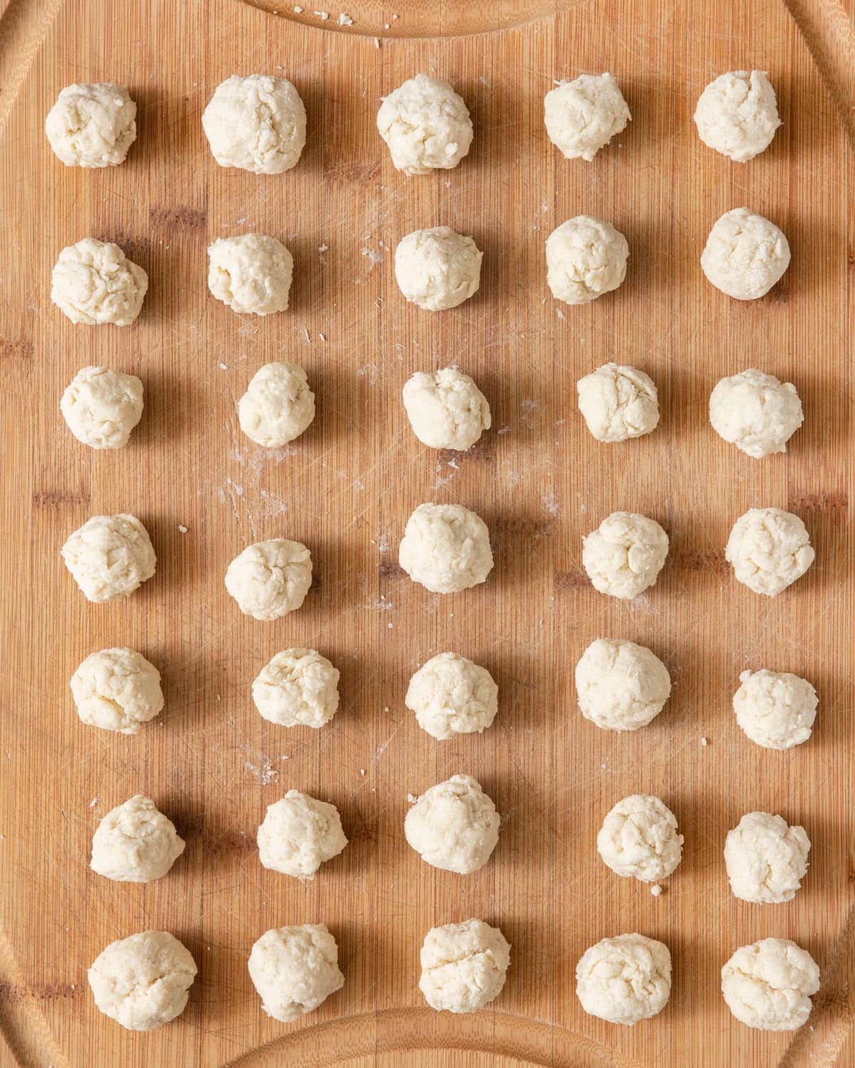 After separating the large dough ball, making small dough balls.