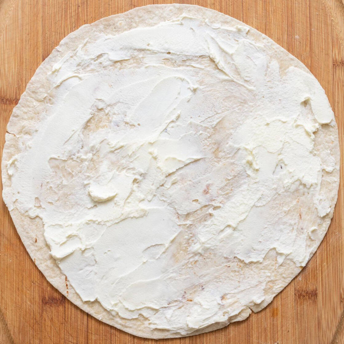 Tortilla with first ingredient.